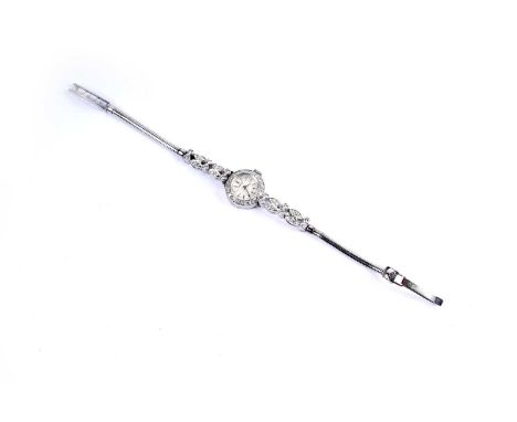 Vertex, Geneve: a platinum cased diamond set cocktail watch, the silvered baton dial fitted a 17-jewel manual wind Swizz move