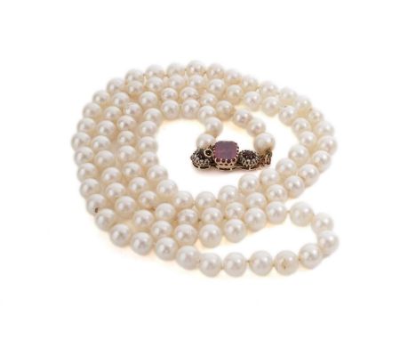 A single strand cultured freshwater pearl necklace, the gold clasp set with a central synthetic ruby measuring 10 x 7.5mm wid