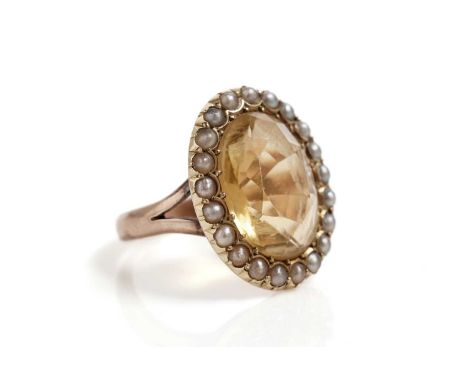 A Victorian citrine and seed pearl cluster ring, in rose gold, stamped "15ct", size K, 5.2g gross.