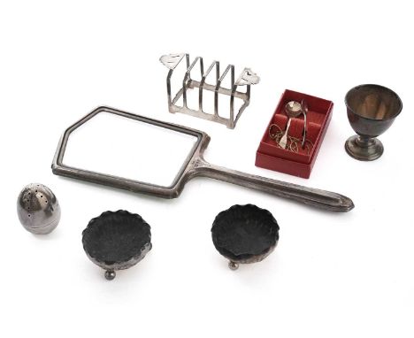 A collection of silver, including: a silver and green enamel hand mirror, by Walker &amp; Hall, Chester 1938, 27.5cms long; a