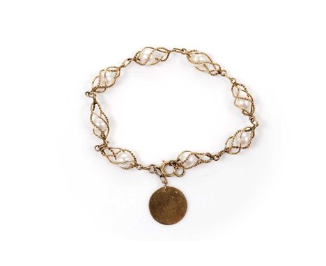 A cultured pearl bracelet, the eight cultured pearls suspended within twisting openwork yellow gold enclosures with rope twis