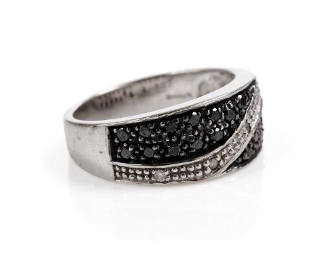 A diamond and black diamond dress ring, in 9ct white gold, size N, 5.4g gross.