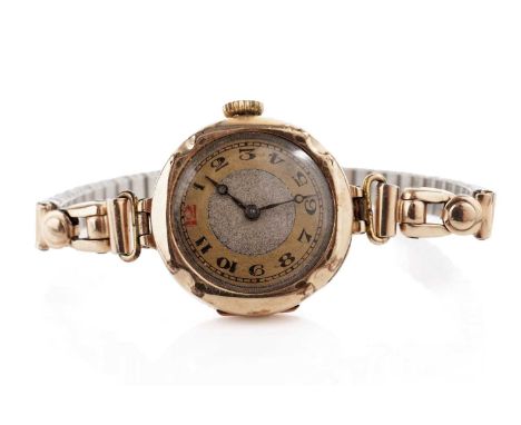 A lady's 9ct gold cased manual wind cocktail wristwatch, the circular dial with Arabic numerals, on an elasticated rolled gol