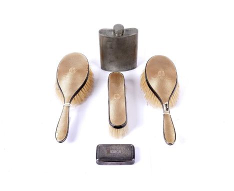 A Victorian silver and peach guilloche enamel dressing table set, maker's mark ‘C D’, London 1864, comprising two hair brushe