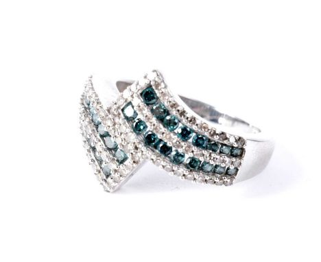A diamond and blue diamond half eternity ring, of twist design, in 9ct white gold, size N 1/2, 4.6g gross.