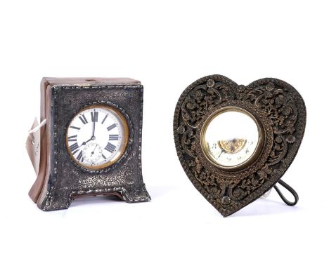 A metal cased open-faced Goliath pocket watch (winding on and ticking over and time of inspection), in a silver mounted leath
