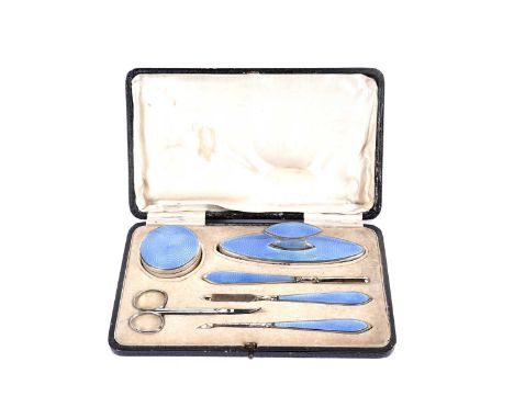 A George V silver and blue guilloche enamel manicure set, by Henry Clifford Davis, Birmingham various dates, with a pair of w