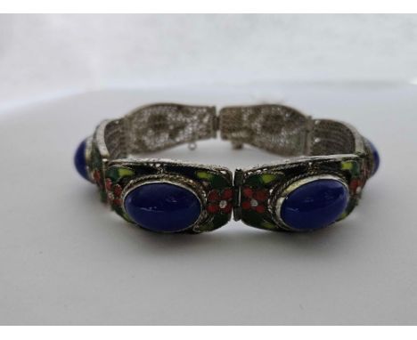 A silver four panel lapis and enamel bracelet