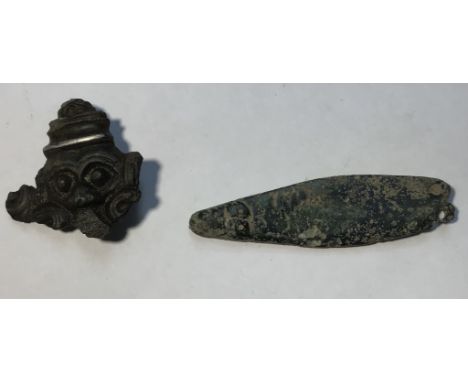Saxon copper alloy 2 item lot. (1)Zoomorphic strap end terminal. 8g.50mm. (2)Chip carved face terminal.6.39g.27x26mm