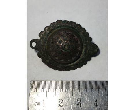 Roman Umbonate Brooch. Circa, 2nd century AD. Copper-alloy, 13.14g, 40mm. An umbonate type brooch decorated with triangular c