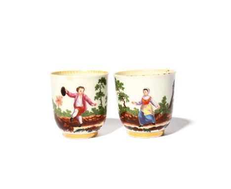 A pair of Worcester coffee cups, c.1770, painted in the London atelier of James Giles with dancing children flanked by trees,
