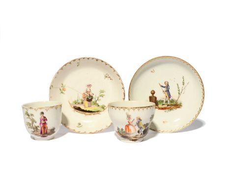 A matched Hague-decorated teacup and saucer and a coffee cup, c.1780, the cups probably German, the saucer Ansbach, the coffe