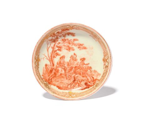 A rare Cozzi saucer, c.1765-70, finely painted in iron red monochrome with a hunting scene of three figures on horseback besi