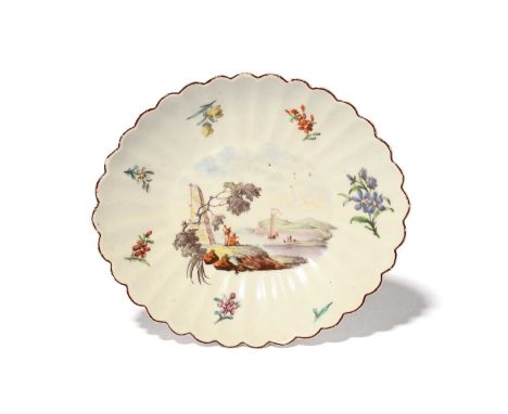 A small Chelsea fluted oval stand or dish, c.1753-54, painted by Jefferyes Hamett O'Neale with Classical travellers beside a 