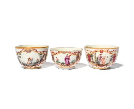 Two Doccia cups and a teabowl, c.1760-70, painted in the Meissen manner, one cup with a girl washing clothes in the river, th