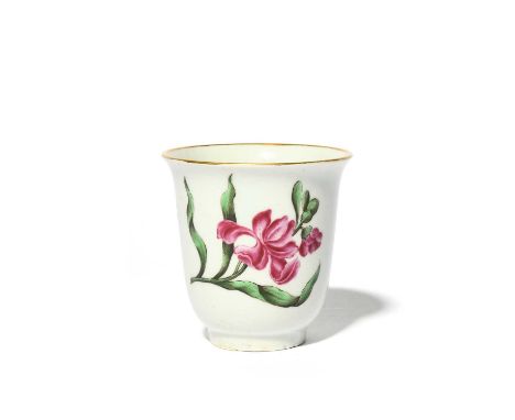 A rare Bow botanical cup, c.1755, the tall slender form copying a Meissen original, finely painted in the Holzschnitt manner 