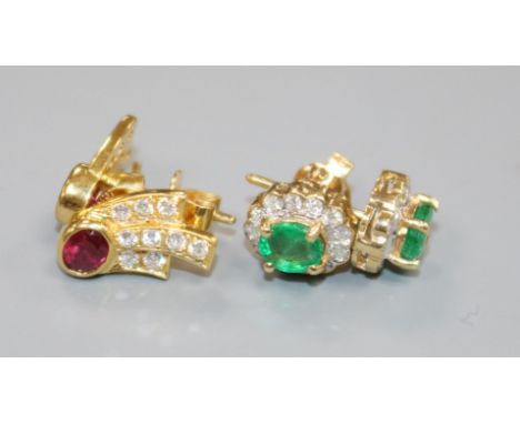 A pair of 14ct gold, emerald and diamond earrings and a pair of 18ct gold, ruby and diamond earrings