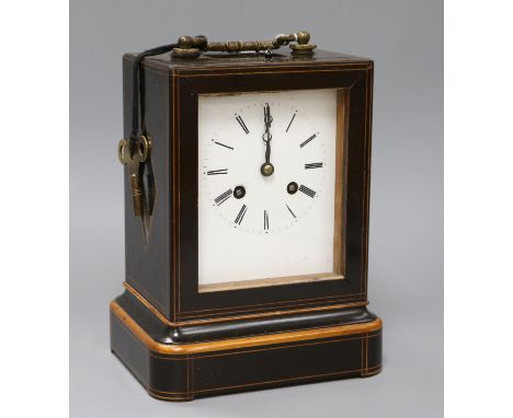 A line-inlaid boxwood and ebonised carriage clock, striking on bell, with white enamelled Roman dial