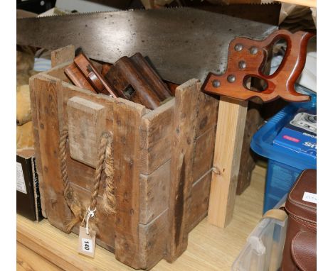 A quantity of woodworking tools, including planes
