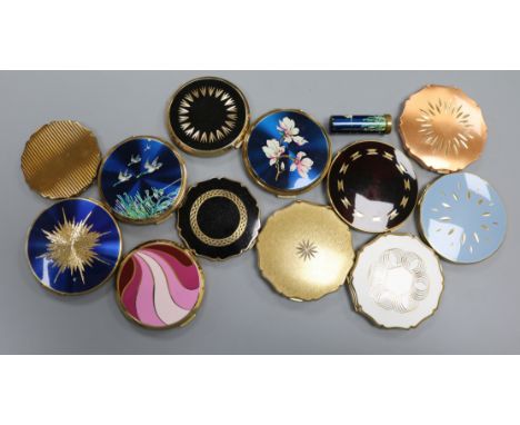 Twelve vintage Stratton powder compacts, including a blue enamelled flying ducks example with matching lipstick holder, one b