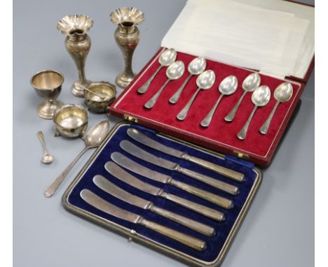 A cased set of eight 1970's silver picture back teaspoons by Mappin &amp; Webb, a cased set of cake knives, silver spill vase
