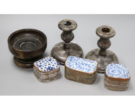 A pair of candlesticks, a turned wood cup and three plated Eastern boxes with ceramic tops
