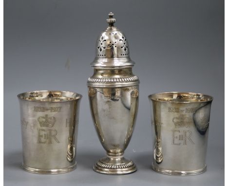 A pair of Tessiers Silver Jubilee beakers and a silver sugar caster, the beakers inscribed 'Here's Health unto Her Majesty' a