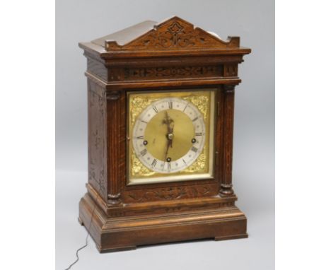 A late Victorian oak repeating bracket clock H.42cm