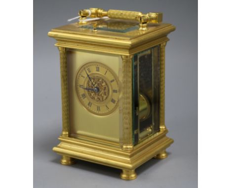 A French gilt brass repeating carriage clock, striking on gong, the movement stamped 'Aiguilles', the gilt Roman dial having 