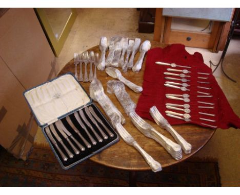 A boxed set of silver butter knives by John Sanderson and Sons Ltd of Sheffield, date marked 1922, along with 12 EPNS   lobst