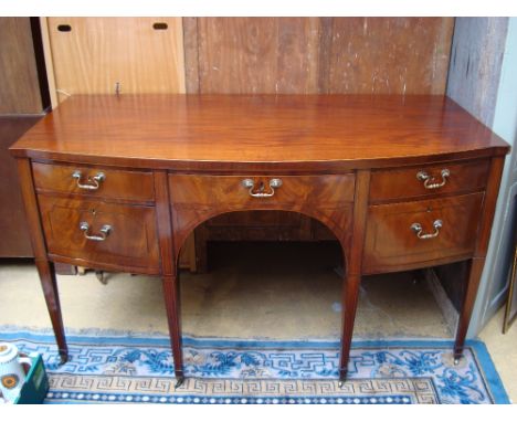 A Regency six legged bow fronted sideboard.