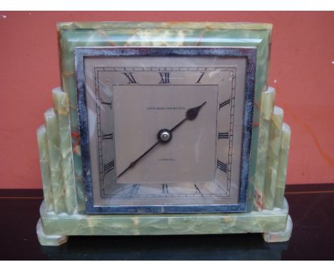 An Art Deco green onyx mantle clock, the 4.5'' square silvered dial signed John Bagshaw and Sons Liverpool. Appears to be in 