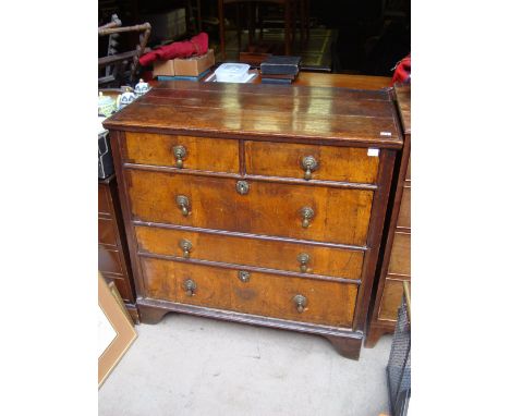A William and Mary walnut, oak and marquetry two section chest of drawers, on bracket feet. 