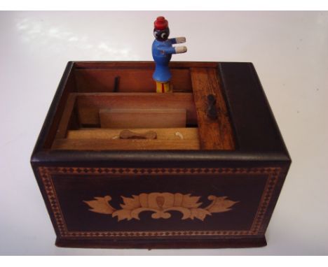 A vintage novelty Japanese cigarette dispenser.