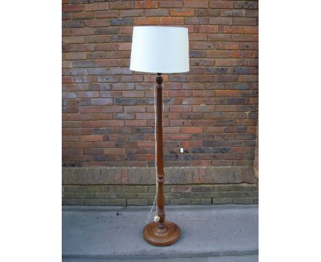 A mahogany standard lamp. 