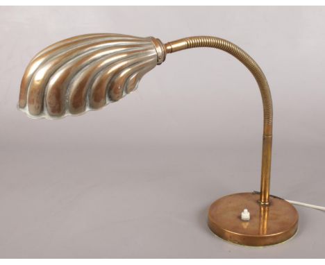 An Art Deco brass adjustable shell lamp.  