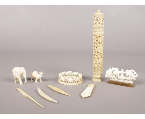 A group of mostly ivory pieces. To include a napkin ring , an small elephant and book mark etc.  