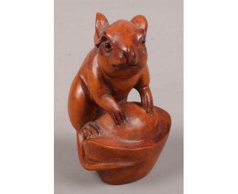 A carved boxwood netsuke formed as a rat.  