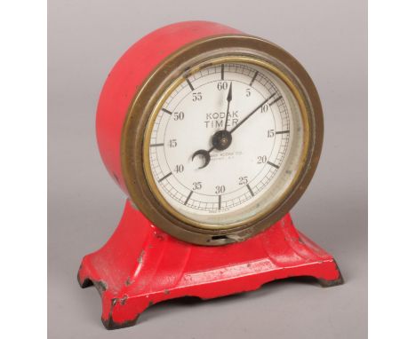 A 1930's red enamel Eastman Kodak darkroom timer with crescent moon hand.  