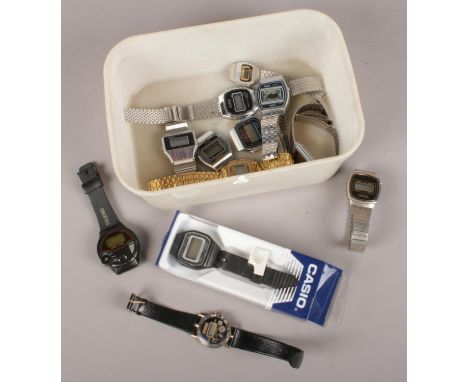A box of assorted digital wristwatches. Including Casio, Citron, etc.  