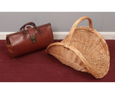 A vintage Gladstone bag along with a wicker basket.  