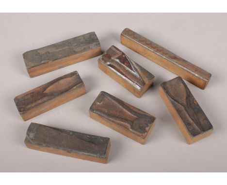 A quantity of antique copper printing blocks, depicting hand tools.  