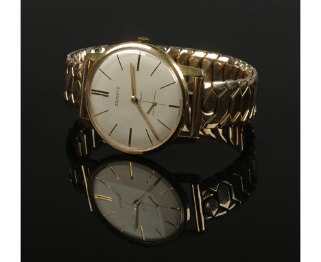 An 18ct gold Senate manual wristwatch on gold plated expanding strap.  
