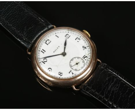 A vintage gents 9ct gold Rolex manual wristwatch on leather strap. With Arabic numeral markers and subsidiary seconds. Import