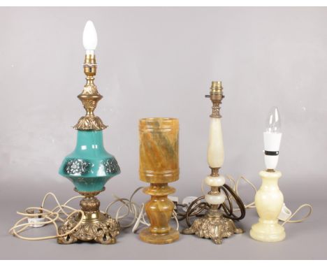 Four desk lamps. To include three Onyx, and one with Onyx shade together with a gilt metal & ceramic example. Tallest: H:43cm