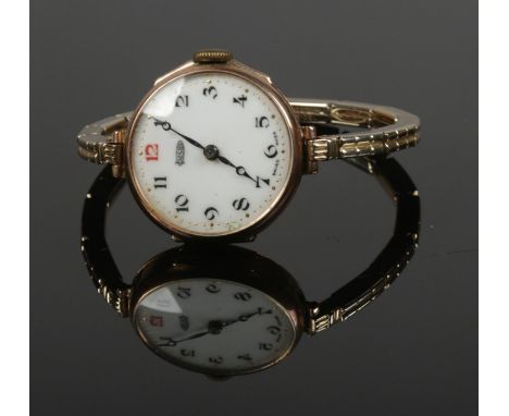 A vintage Imshi 9ct gold manual wristwatch on stainless steel expanding strap.  