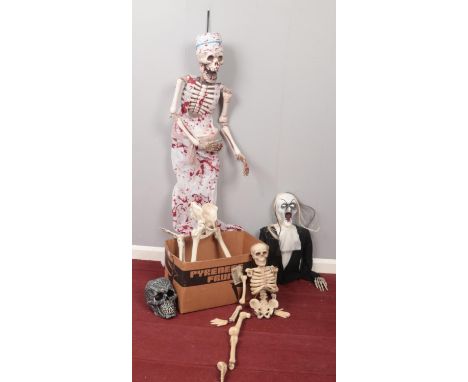 A box of assorted Halloween props/decorations.  