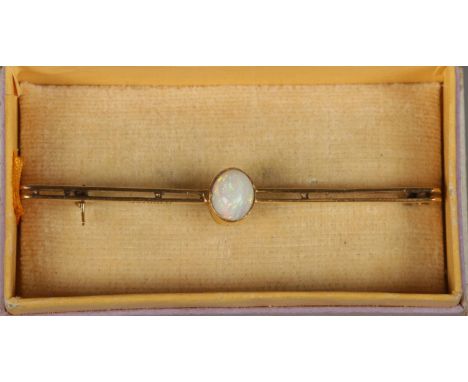 A 9ct gold and opal bar brooch.  