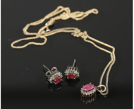 A set of Sterling Silver Diamond & Ruby earrings together with matching pendant necklace. Necklace length: 25cm. Total weight