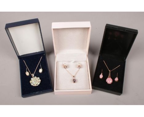 Three boxed jewellery sets. Includes silver and opal, rose quartz coloured etc.  